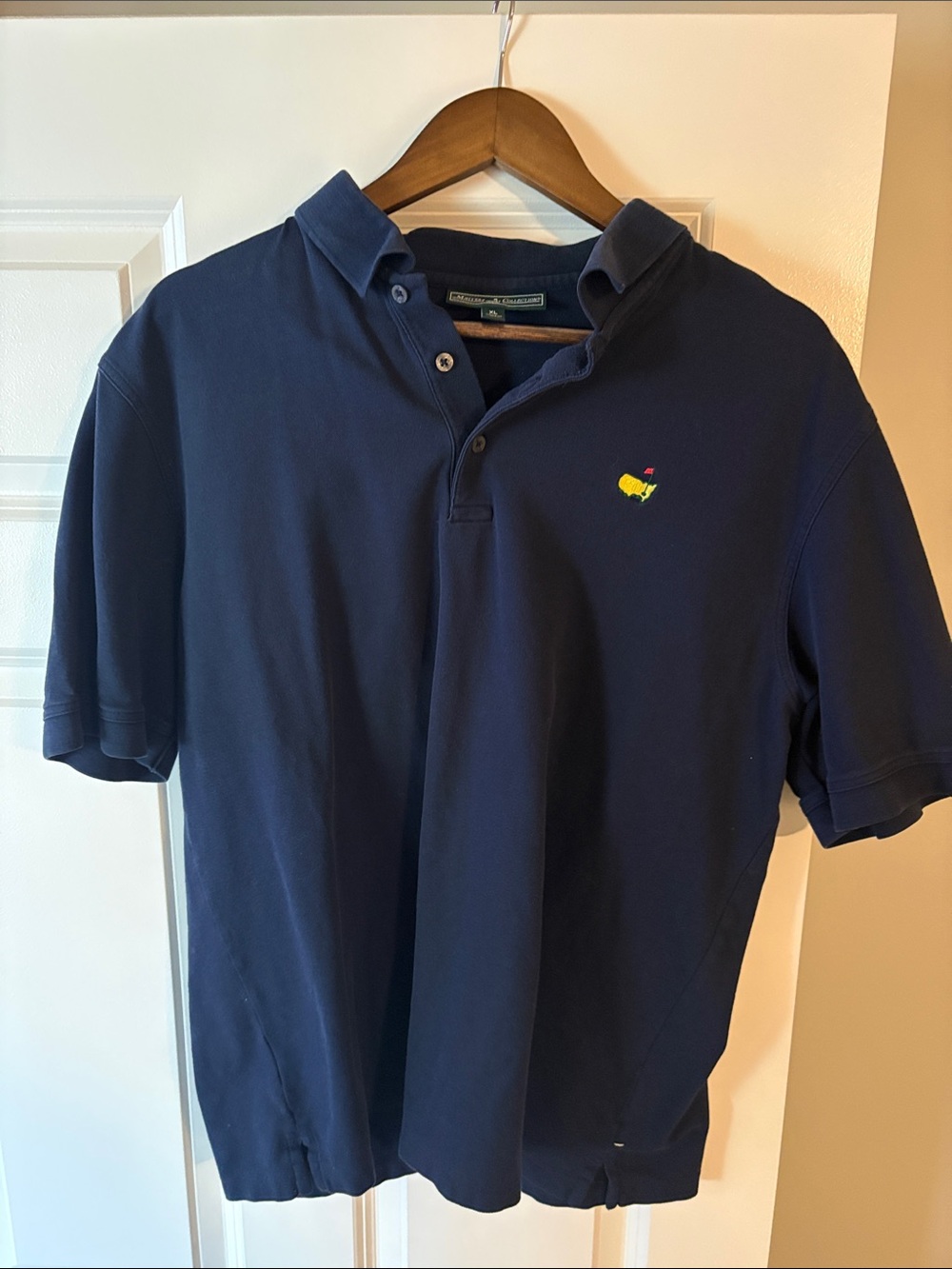 Masters Navy Polo with Yellow & Red Chest Emblem